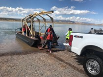 Abiquiu staff and volunteers remove trash from the lake during the National Public Lands Day event, N.M., Sept. 25, 2021. In total, 19 large tires were removed. Abiquiu staff and volunteers remove trash from the lake during the National Public Lands Day event, N.M., Sept. 25, 2021. In total, 19 large tires were removed.